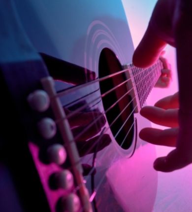 Stock Image of Person Playing Guitar